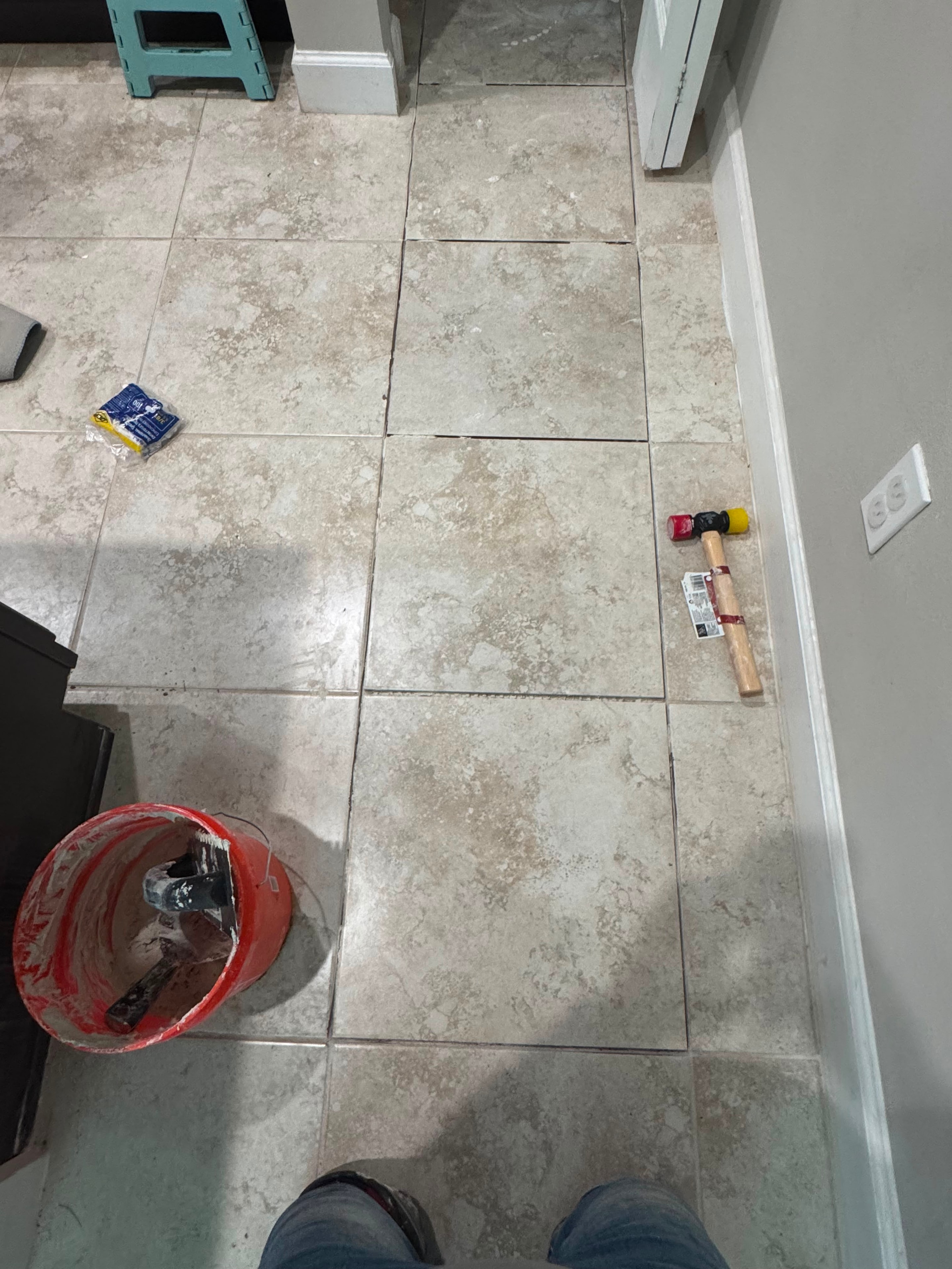 Bio-Cleaning Services crew installing new tile flooring in residential property — Central Florida.