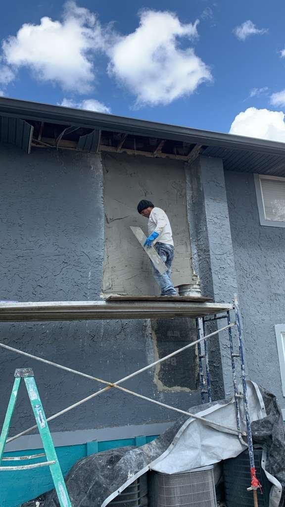 Bio-Cleaning Services crew performing exterior wall restoration and building-envelope repair — Central Florida.