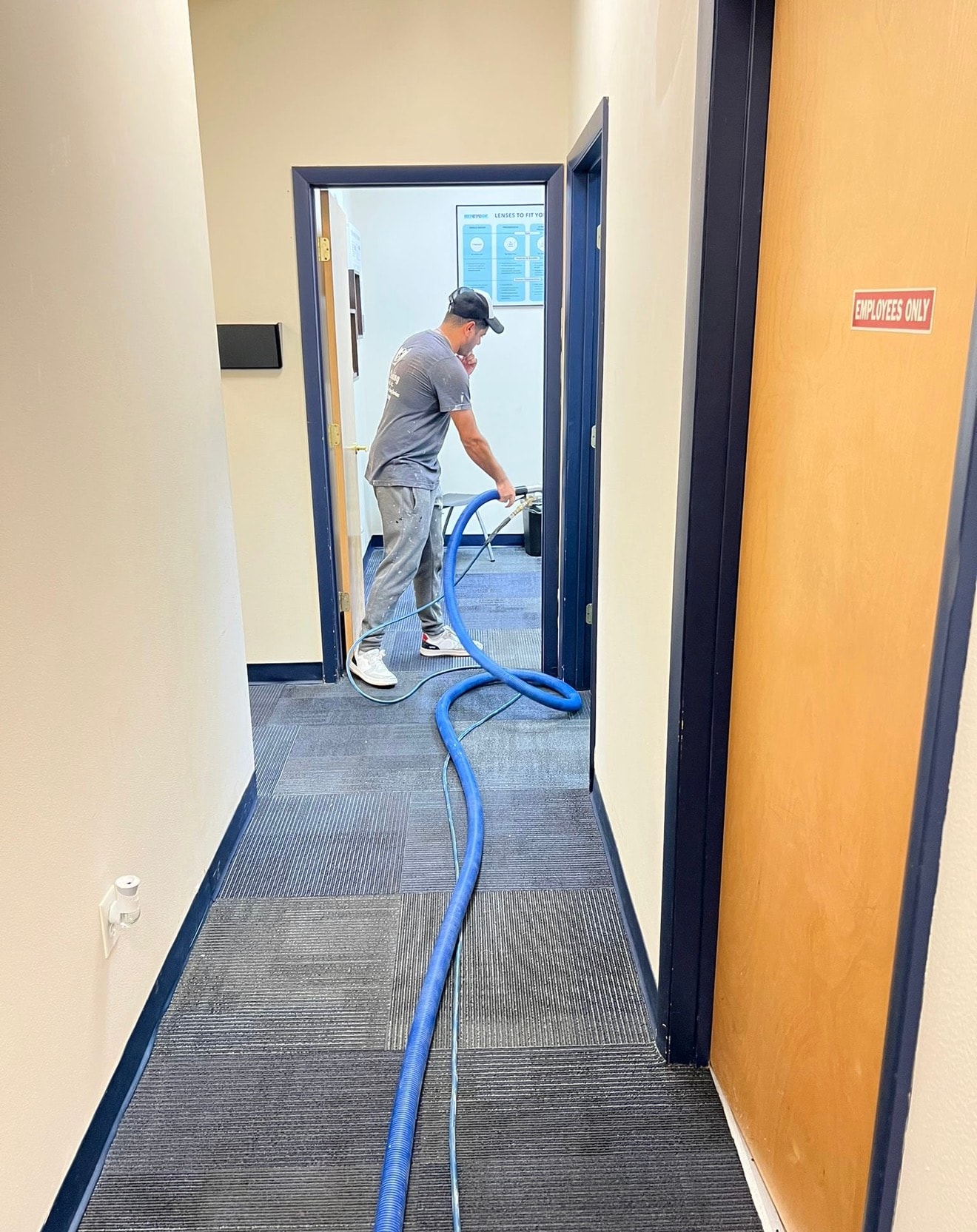 Bio-Cleaning Services technician performing commercial carpet extraction and cleaning.