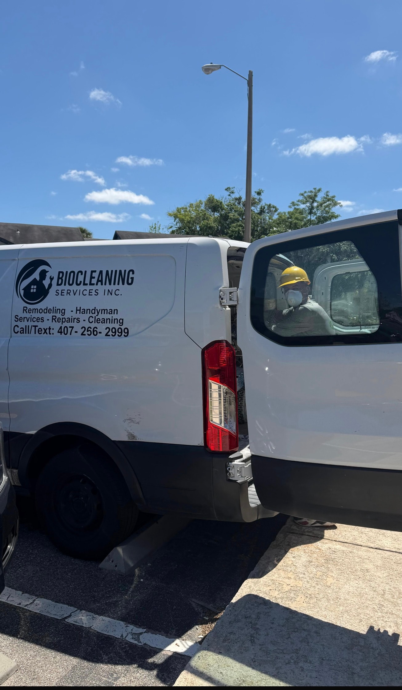 Bio-Cleaning Services technician and service van prepared for property turnover and make-ready work.
